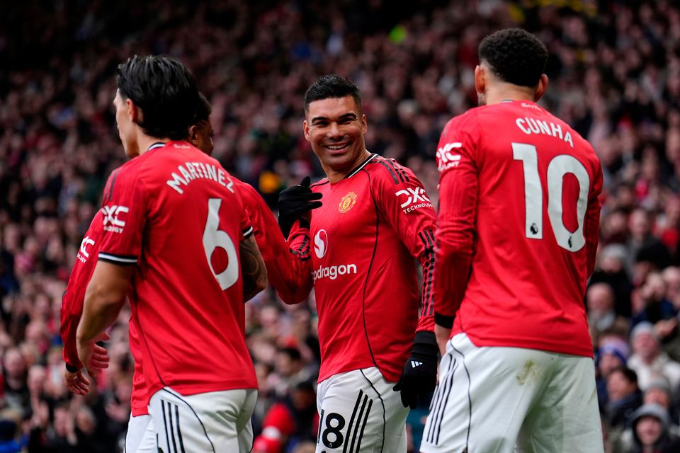 Manchester United's Casemiro (centre) celebrates with his teammates after scoring his sides first goal during the Premier League match at Old Trafford against Fulham. (Martin Rickett/PA Wire)